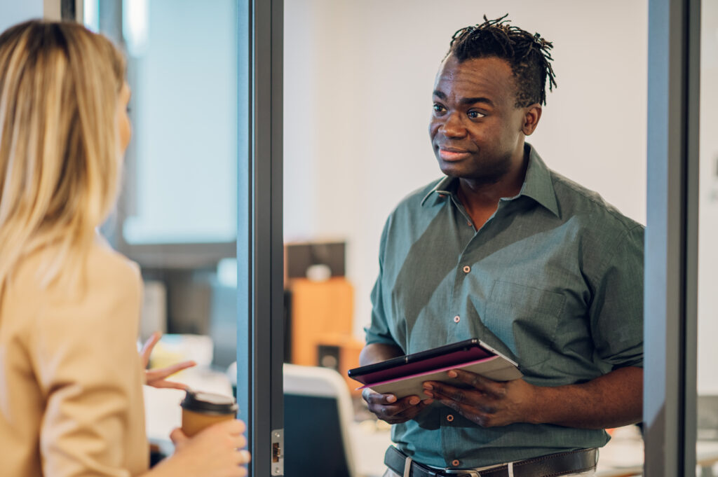 A direct sales rep talking about growth with his manager