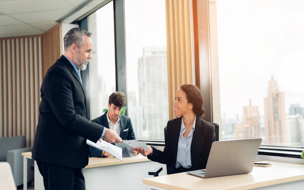 A new sales representative getting a report from her manager